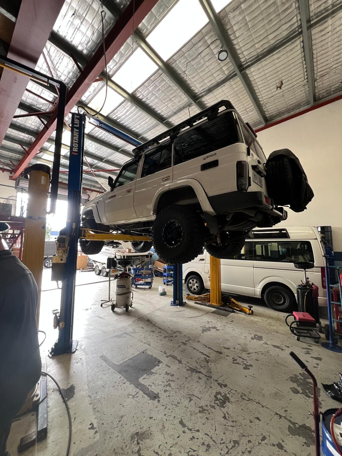 A Toyota Land Cruiser 76 Series up on a hoist